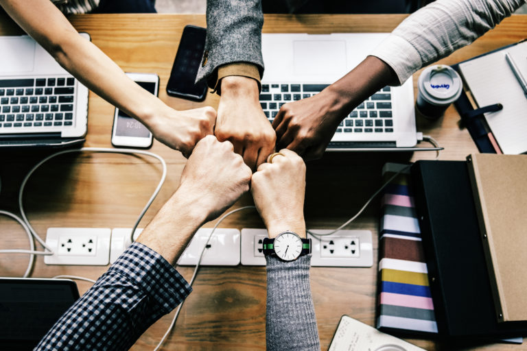 Colleagues giving a fist bump